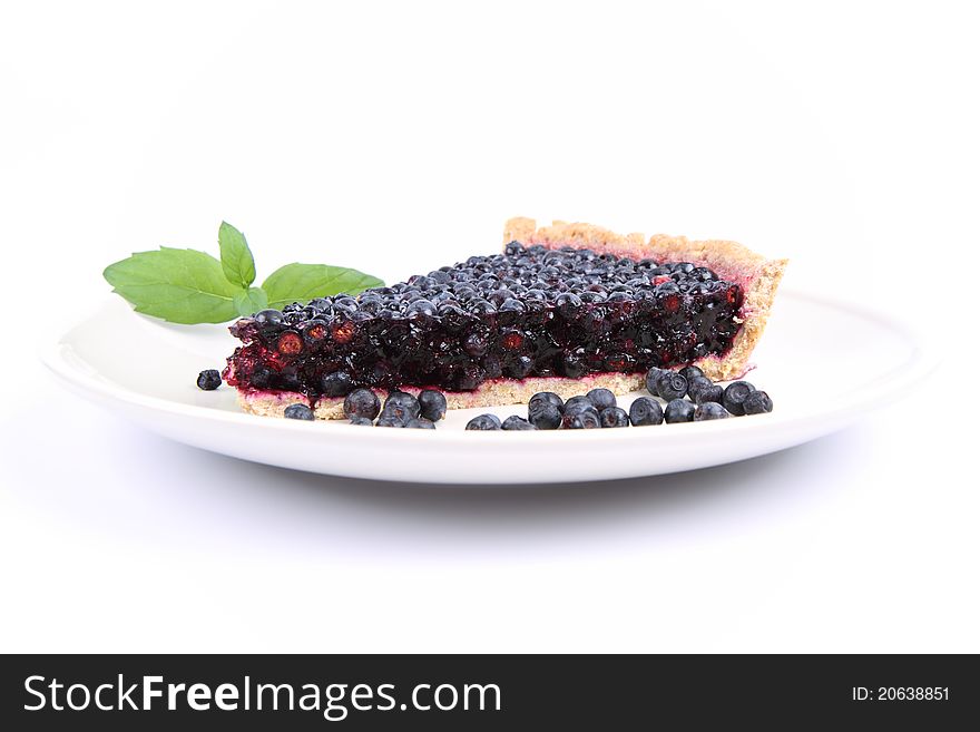 Blueberry Tart: a portion on a plate decorated with mint