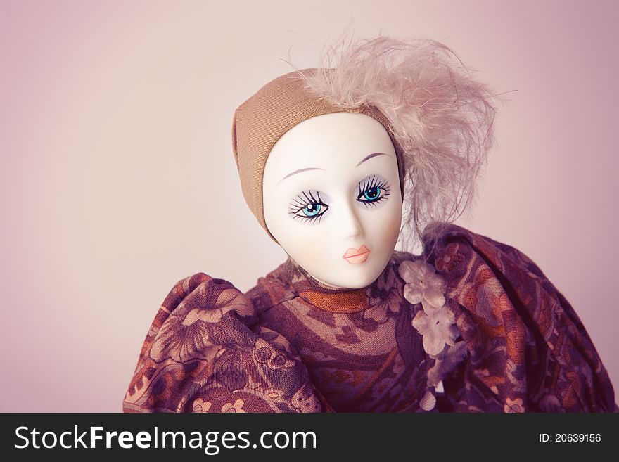 Woman's beauty concept - vintage porcelain lady doll with beautiful make-up on her face