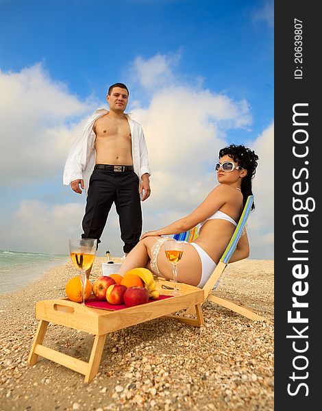 Couple Resting On The Beach