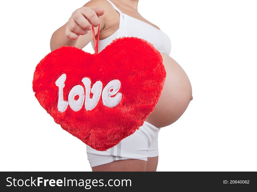 Pregnant woman hold red hart with love in hands on white background