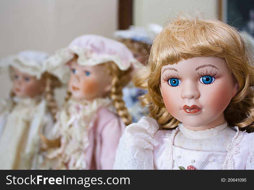 Collection of vintage porcelain dolls in Victorian and Edwardian dress