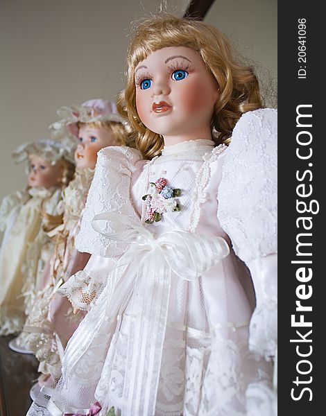 Collection of vintage porcelain dolls in Victorian and Edwardian dress