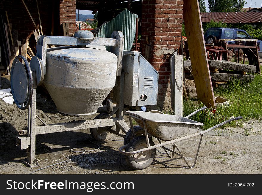 Detail of a yard with wheelbarrow. Detail of a yard with wheelbarrow