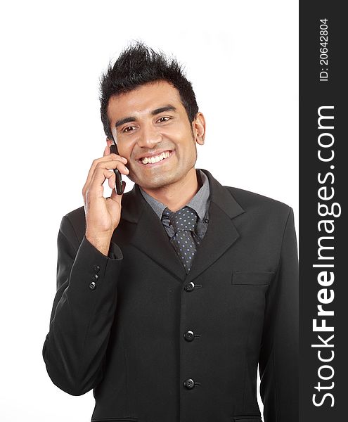 Business man talking on the phone and smiling. Business man talking on the phone and smiling