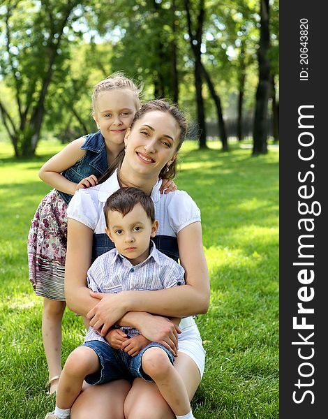Mother with dausghter and son together in the park