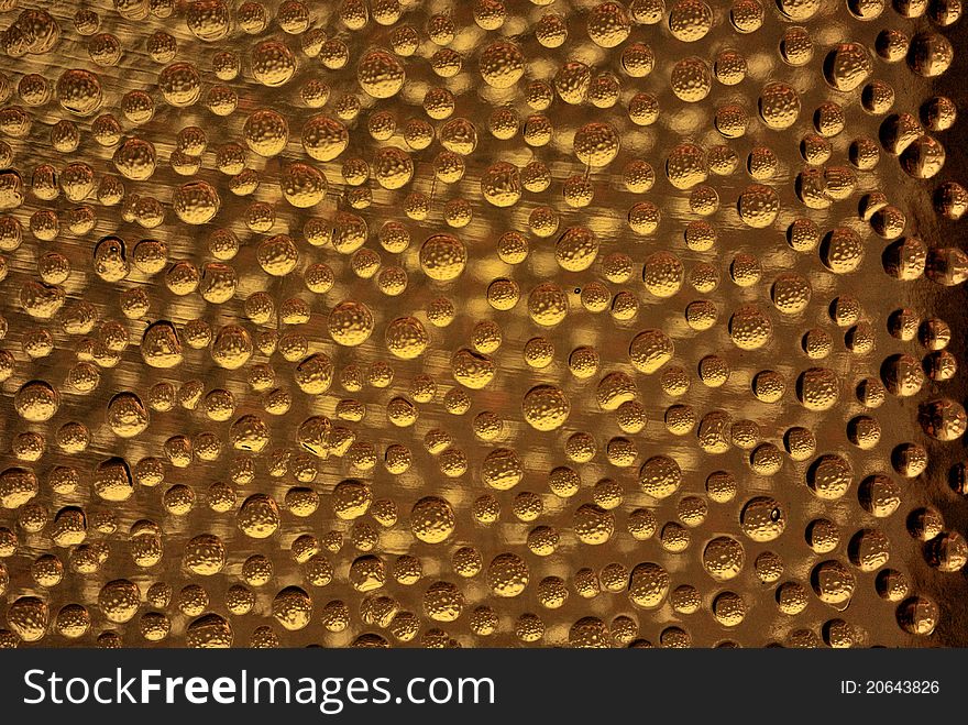 Orange colored bubbles on a glass brick. Orange colored bubbles on a glass brick