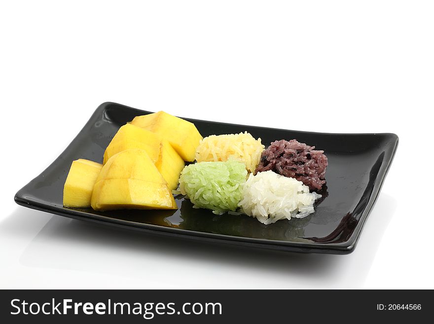 Mango with rice dessert isolated in white background