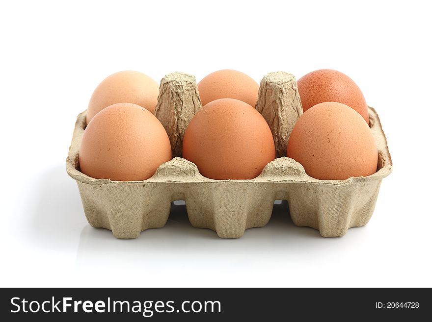 Eggs in the package isolated in white background