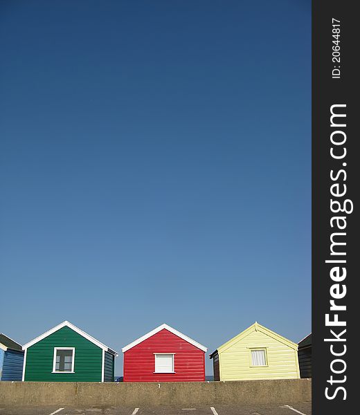 Cheerful Beach Huts On An English Beach