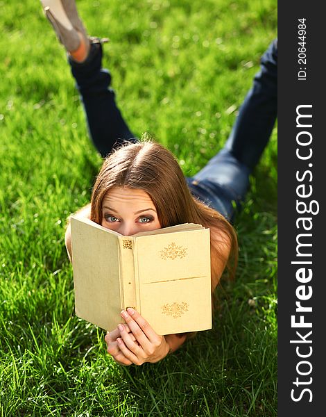 Woman in the park with book