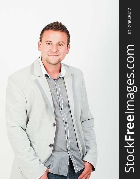 Portrait of happy smiling young business man, isolated on white background