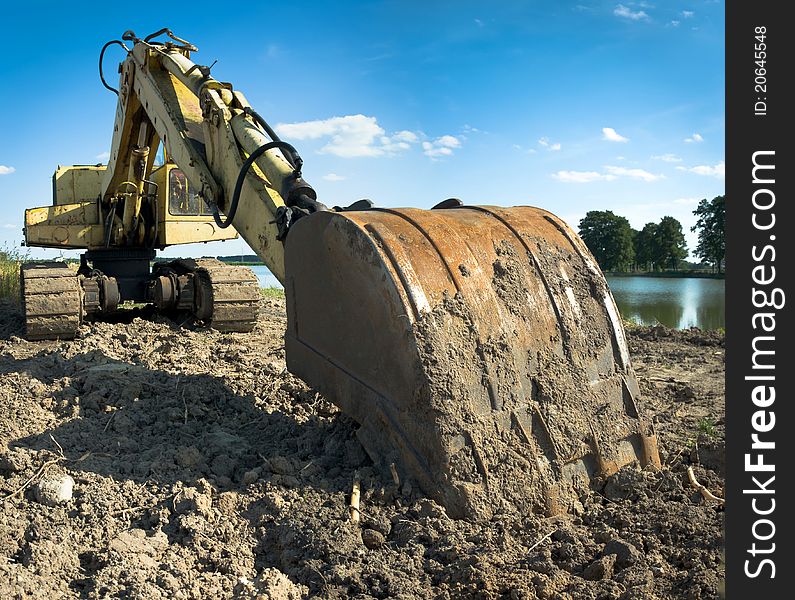 Digger, Heavy Duty construction equipment parked at work site