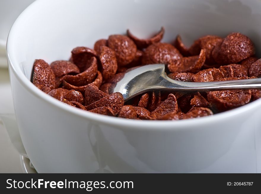 Chocolate flakes breakfast with spoon