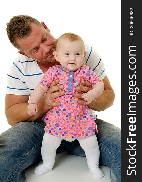 Happy and smiling baby and father. The baby 3 month old. Isolated on a white background. Happy and smiling baby and father. The baby 3 month old. Isolated on a white background.