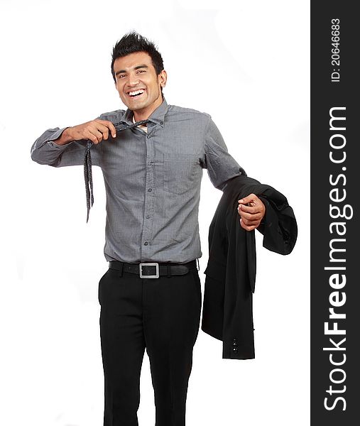 Young businessman untying his tie isolated on white background