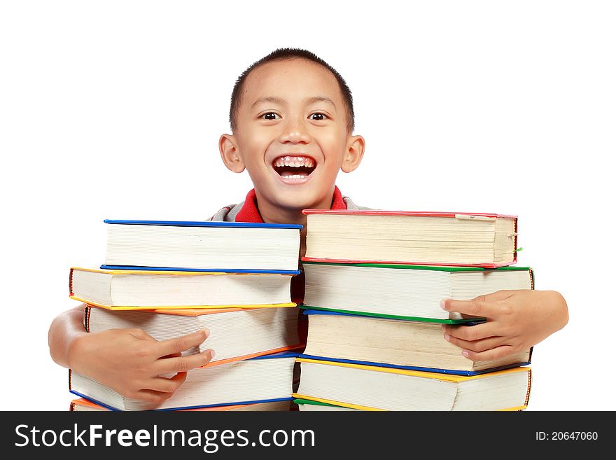 Child smiling with a lot of book on his chest isolated on white background. Child smiling with a lot of book on his chest isolated on white background