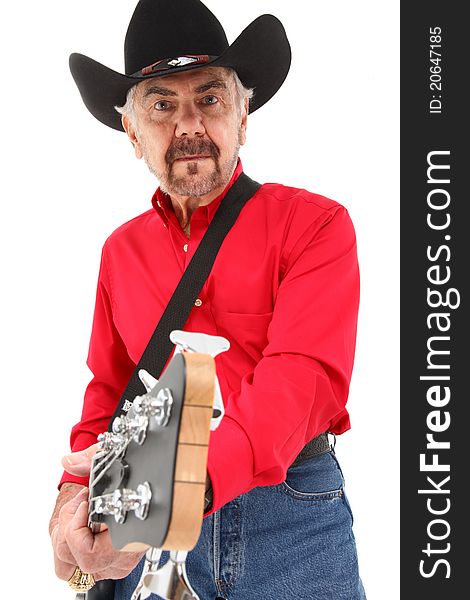 Handsome elderly 75 year old country musician with electric bass guitar and cowboy hat over white background. Handsome elderly 75 year old country musician with electric bass guitar and cowboy hat over white background.