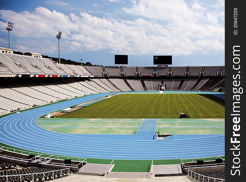 Empty field, track and stands of olympic stadium in Barcelona