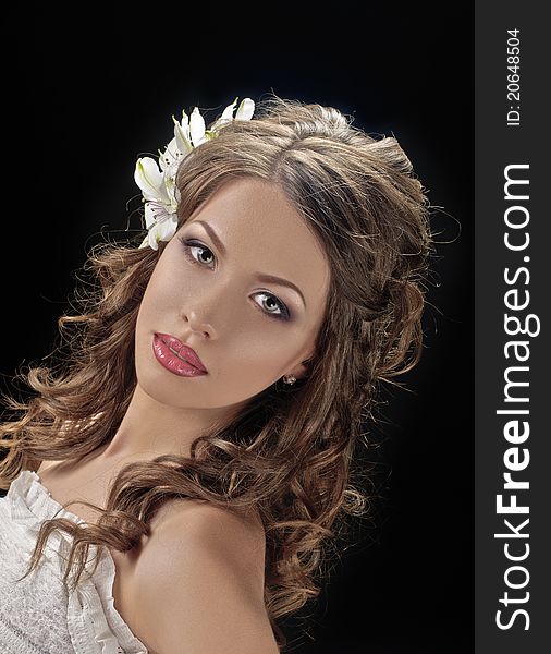 Portrait of beautiful bride with flowers in hair on black. Portrait of beautiful bride with flowers in hair on black