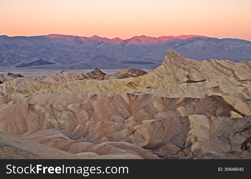 Sun rising over colorful rock formation at zabriskie point,death valley,california,november 2009. Sun rising over colorful rock formation at zabriskie point,death valley,california,november 2009.
