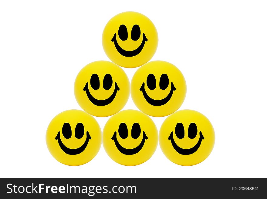 Perfect order of smiling happy balls on a white background. Perfect order of smiling happy balls on a white background.