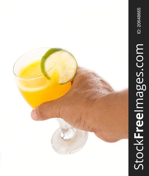Hand picking up a glass of orange juice. Hand picking up a glass of orange juice