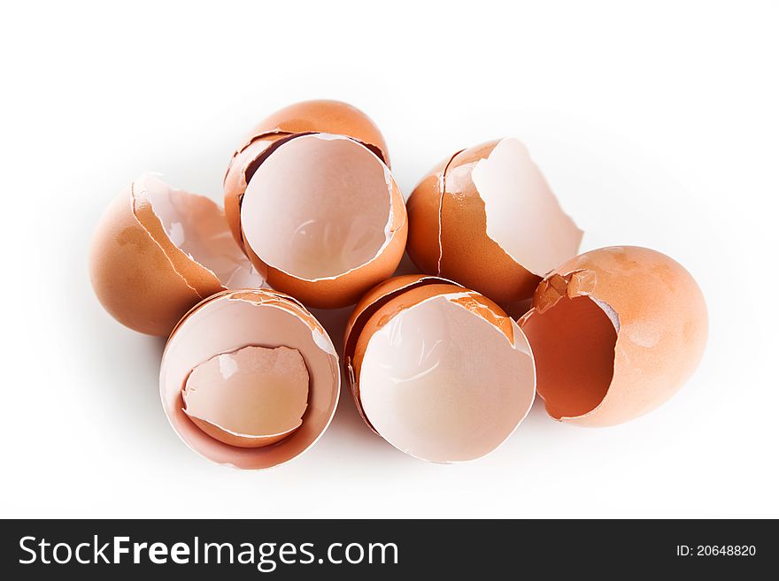 The brown eggshells in the white kitchen table