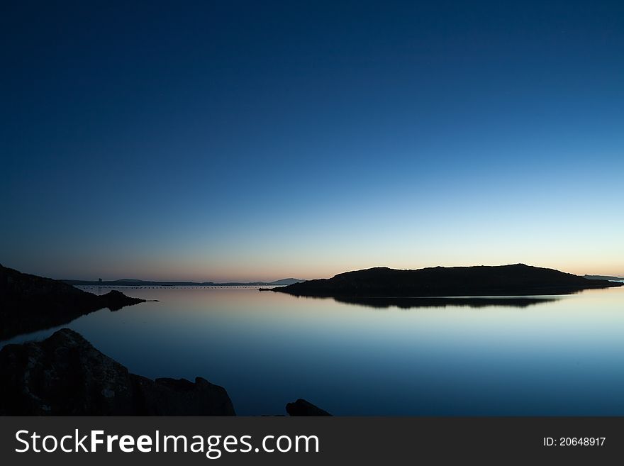 Calm waters amid small islands at sunset in West Cork, Ireland. Calm waters amid small islands at sunset in West Cork, Ireland