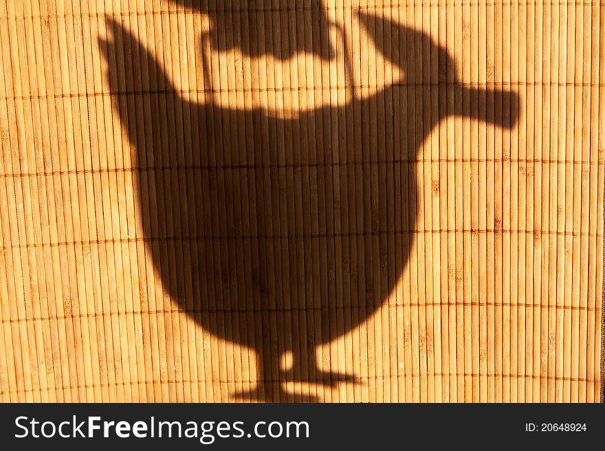 Shape of teapot on the bamboo background
