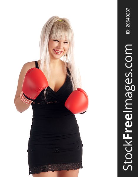 Stylish, glamour girl In boxing gloves on a white background, looks at you