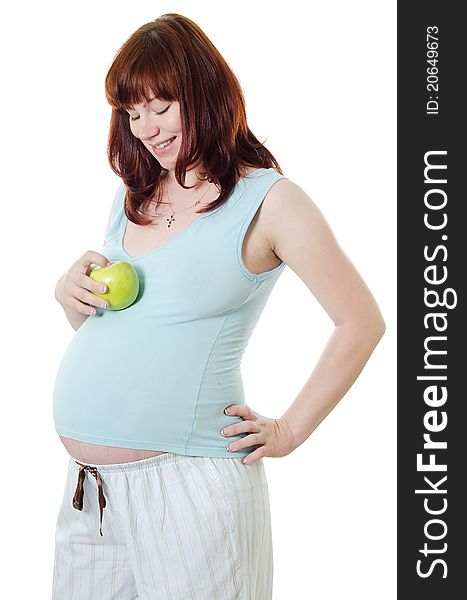 The pregnant woman with an apple on white