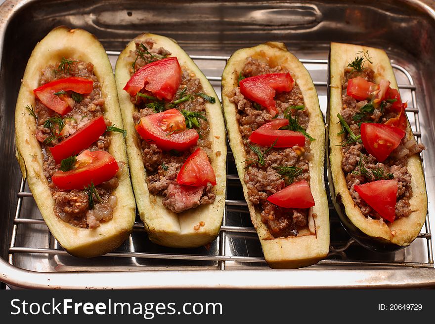 Eggplant stuffed with meat in metal pan