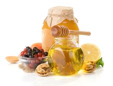 Glass Jar Full Of Honey, Lemon And Berry Royalty Free Stock Images Glass Jar Full Of Honey, Lemon And Berry Royalty Free Stock Images