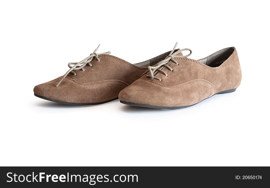 Pair of modern woman leather shoes isolated on white background. Clipping path is included. Pair of modern woman leather shoes isolated on white background. Clipping path is included