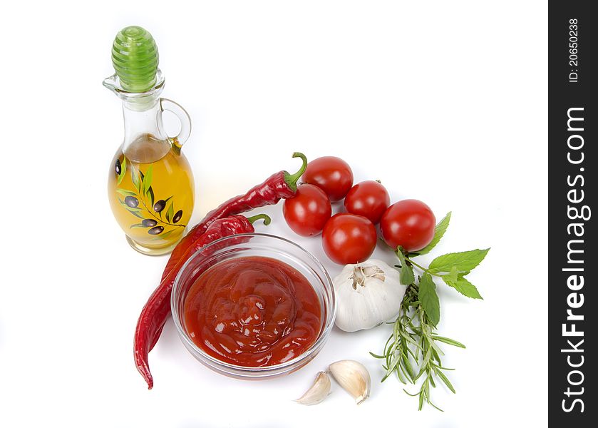 Vegetables and ketchup on white background