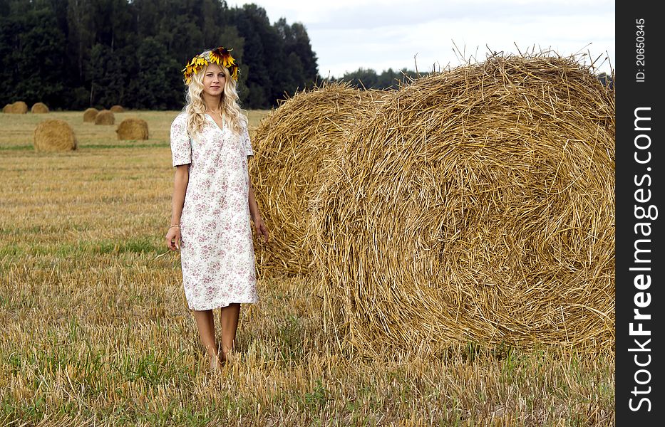 Beautiful girl in chaplet on nature. Beautiful girl in chaplet on nature