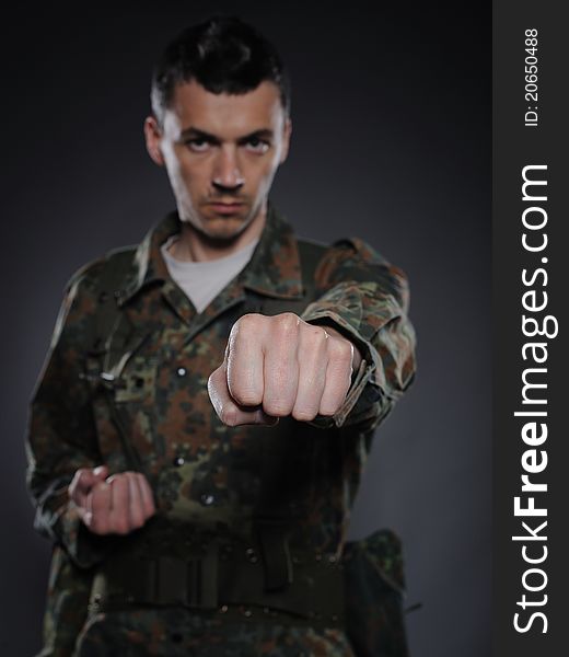 Portrait Of Soldier In Camouflage Fighting