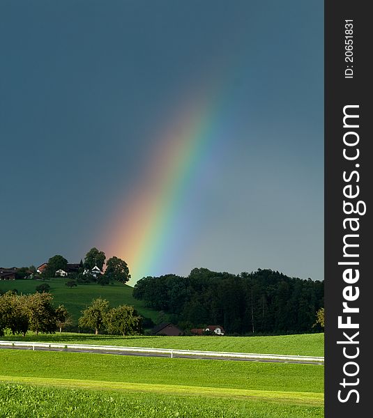 Fading Rainbow across a field. Fading Rainbow across a field