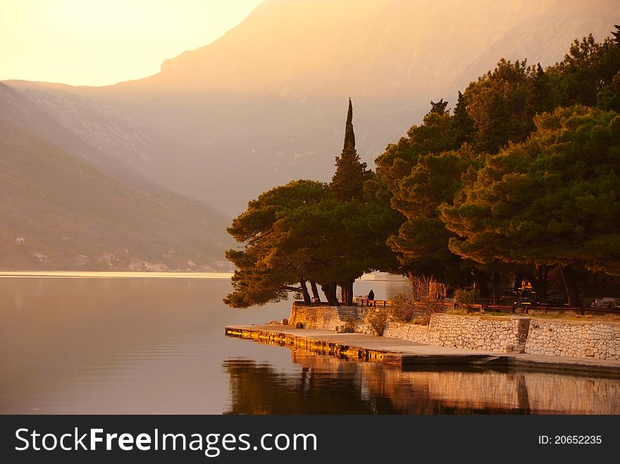 Waterscape with old park on sunset by Perast, Montenegro