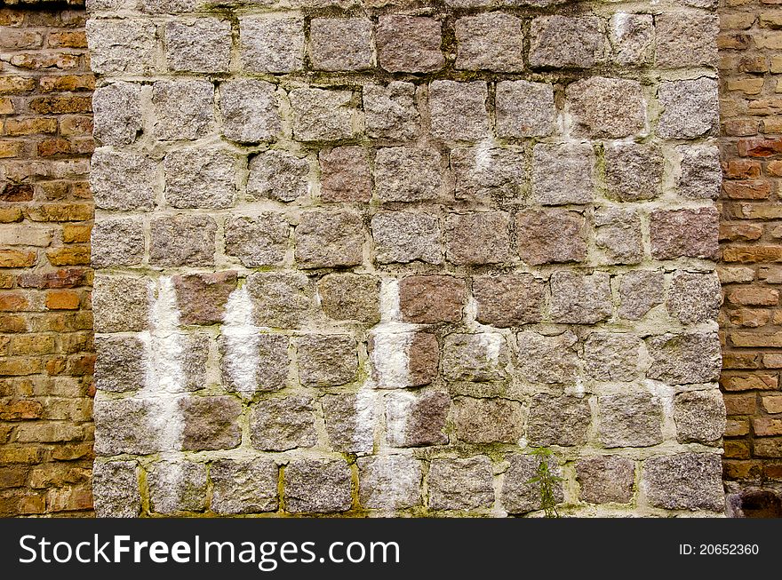 Old bridge stone bricks wall background. Old bridge stone bricks wall background