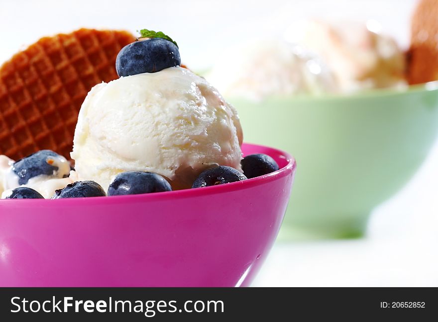 Cup of ice cream with berry fruits
