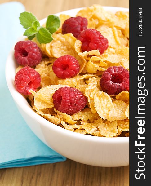 Bowl with corn flakes with fresh raspberries. Bowl with corn flakes with fresh raspberries