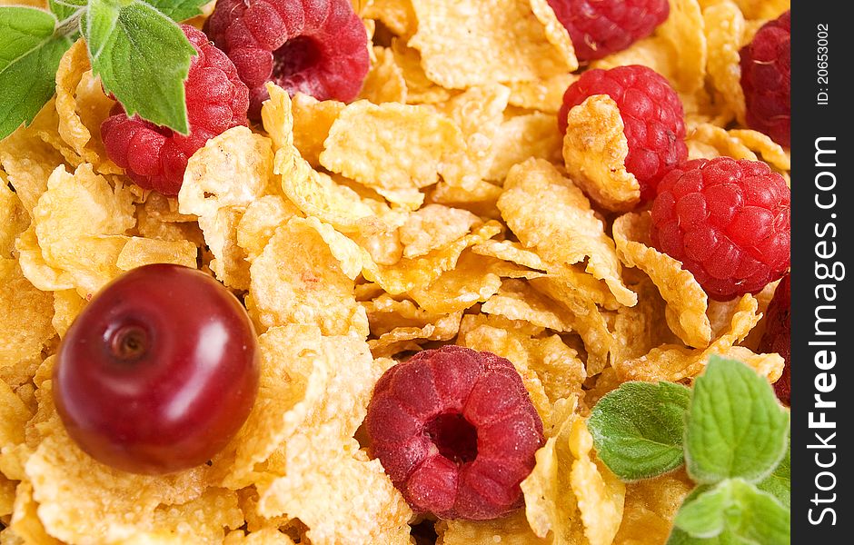 Corn flakes with fresh cherries and raspberries. Corn flakes with fresh cherries and raspberries