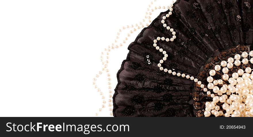 Photo of a pearls on a black fan