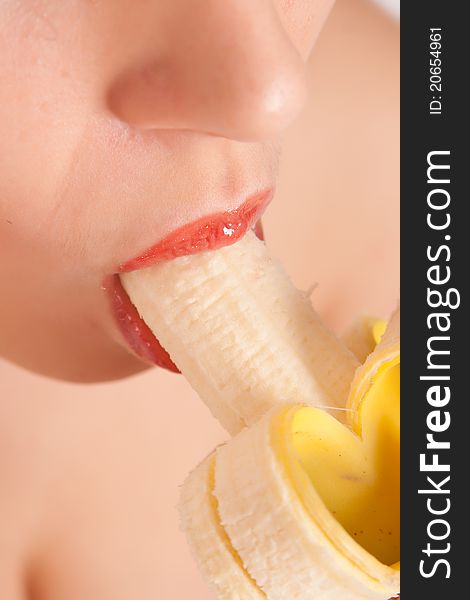 Young Woman Eating Banana