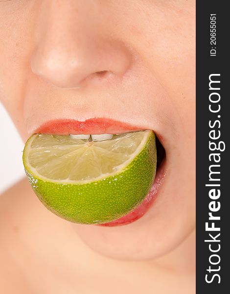 Girl biting lime