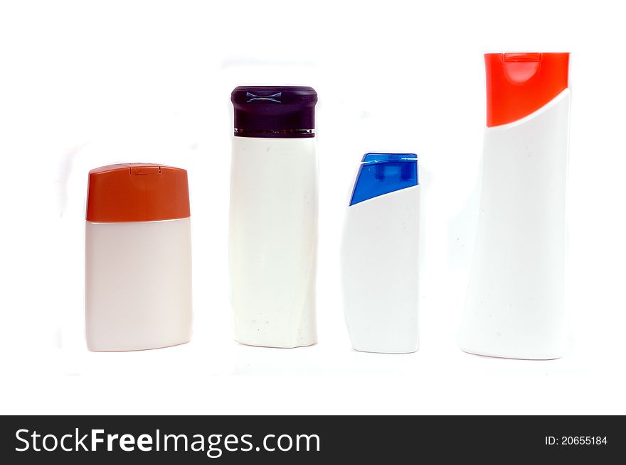 Four plastic containers for bath fixtures isolated on white background