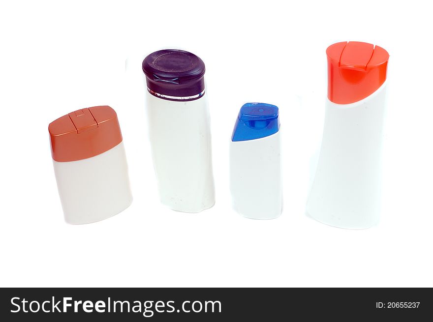 Four plastic containers for bath fixtures isolated on white background