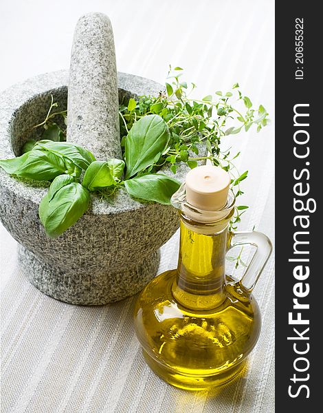 Granite mortar, fresh herbs and olive, still life. Granite mortar, fresh herbs and olive, still life.