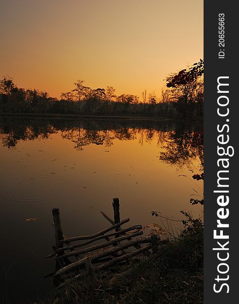 Beautiful golden sunset over serene lake in the wilderness. Beautiful golden sunset over serene lake in the wilderness.